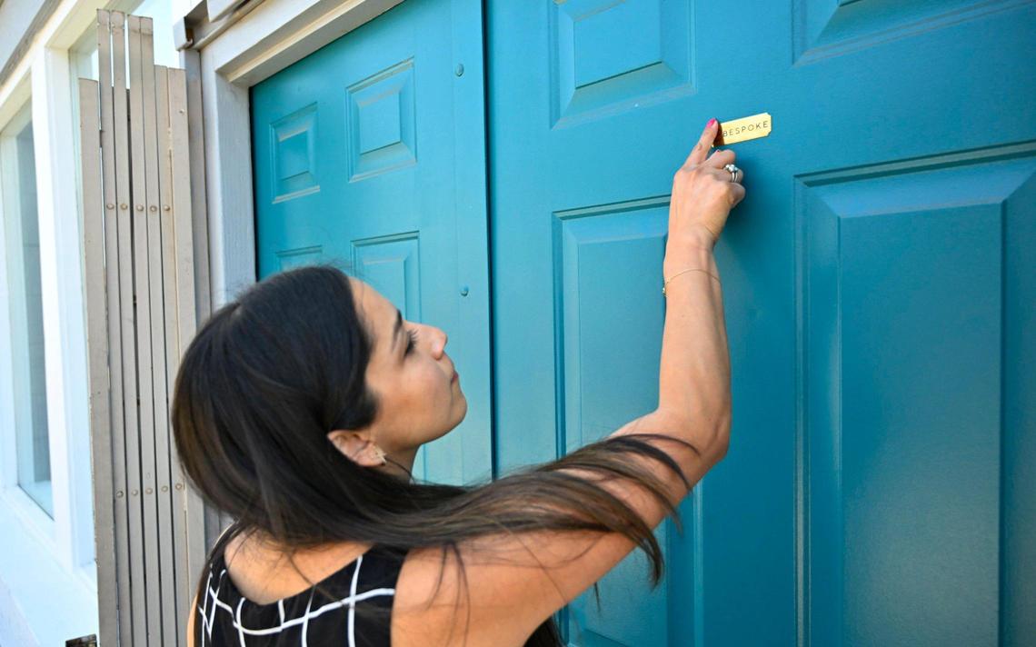 Co-owner Carmen Serrato shows the nameplate for Bespoke, a new cocktail bar she has opened in Fresno’s Brewery District. The bar, open for reservations only, offers a special atmosphere and unique approach to drinks. Photographed Monday, June 26, 2023 in downtown Fresno.