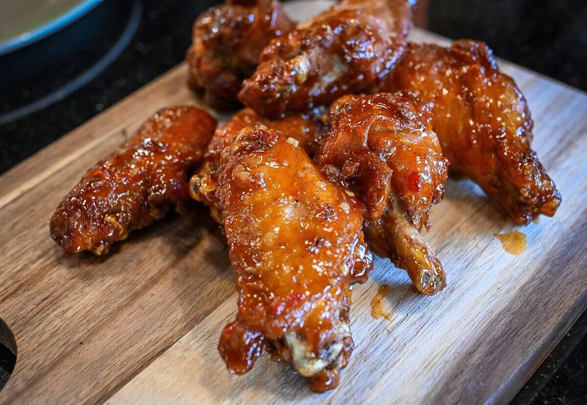 Sweet chili wings are ready to devour at The Curry Pizza Company's newest location on Fowler southeast of Belmont in the Sunnyside area of Fresno. This location is the first to have a full bar.