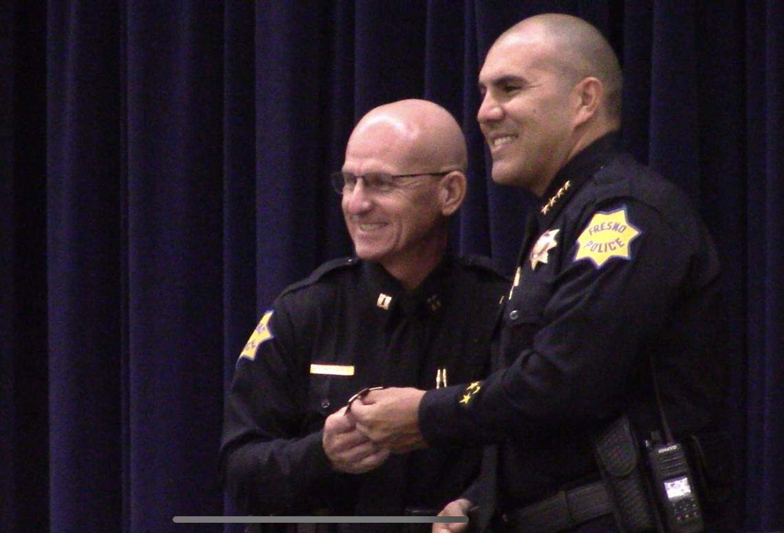 Robert Beckwith takes a picture with Fresno Police Chief Paco Balderrama after receiving his badge as the next Captain of the police department on Tuesday, Aug. 10, 2021.