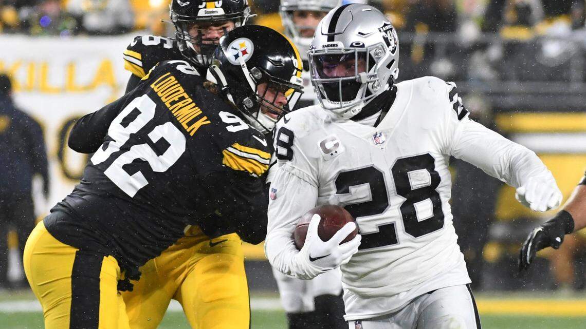 Las Vegas Raiders running back Josh Jacobs carries the ball during the first half of an NFL game against the Pittsburgh Steelers in Pittsburgh, Saturday, Dec. 24, 2022.