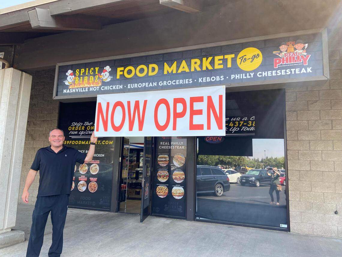 Co-owner Paul Yanbekov stands outside the newly opened Food Market at Herndon and West avenues, which also serves Spicy Birdz Nashville hot chicken and Real Philly Cheesesteak.