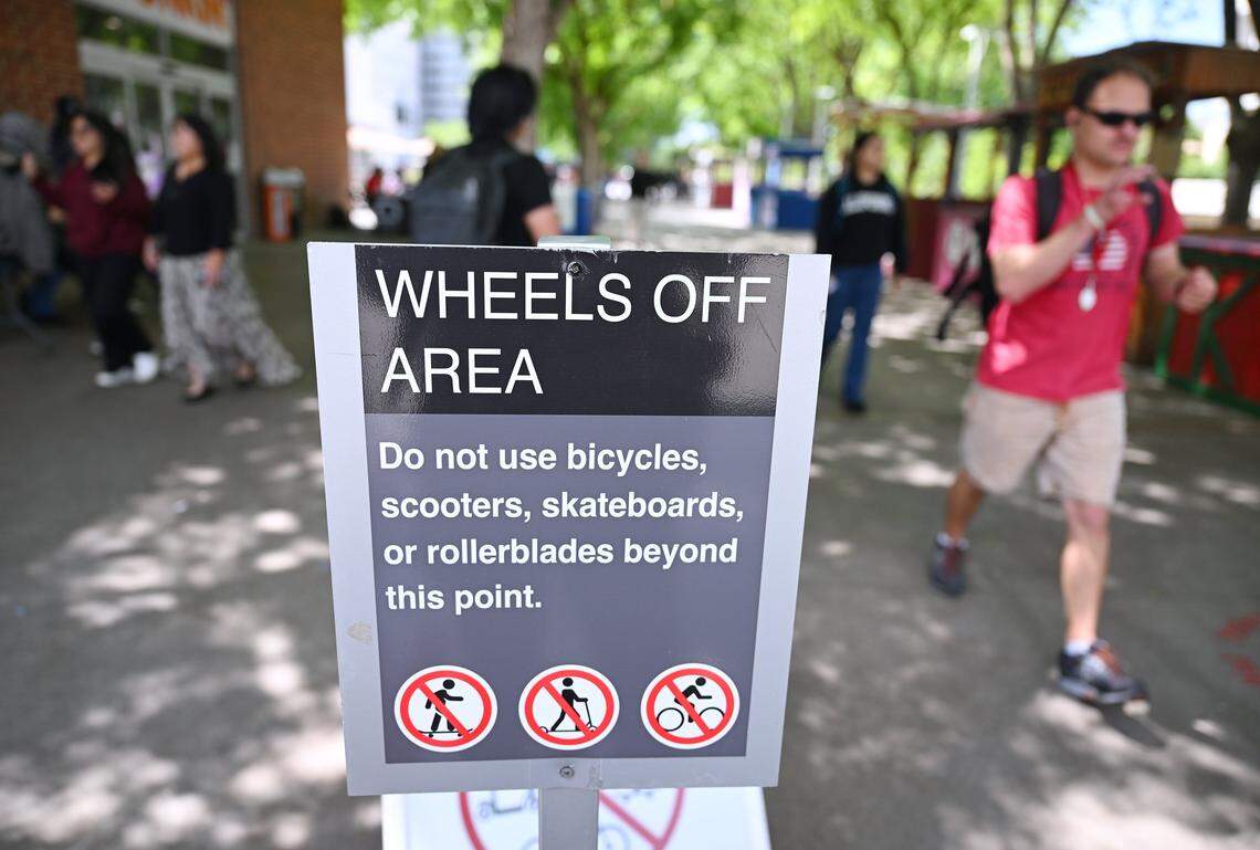 Designated areas on Fresno State's campus currently prohibit motorized scooters with signs as shown. Fresno State will begin a ban on all motorized scooters, skate boards and bikes starting August 19 this year. Photographed Monday, April 27, 2026 in Fresno.