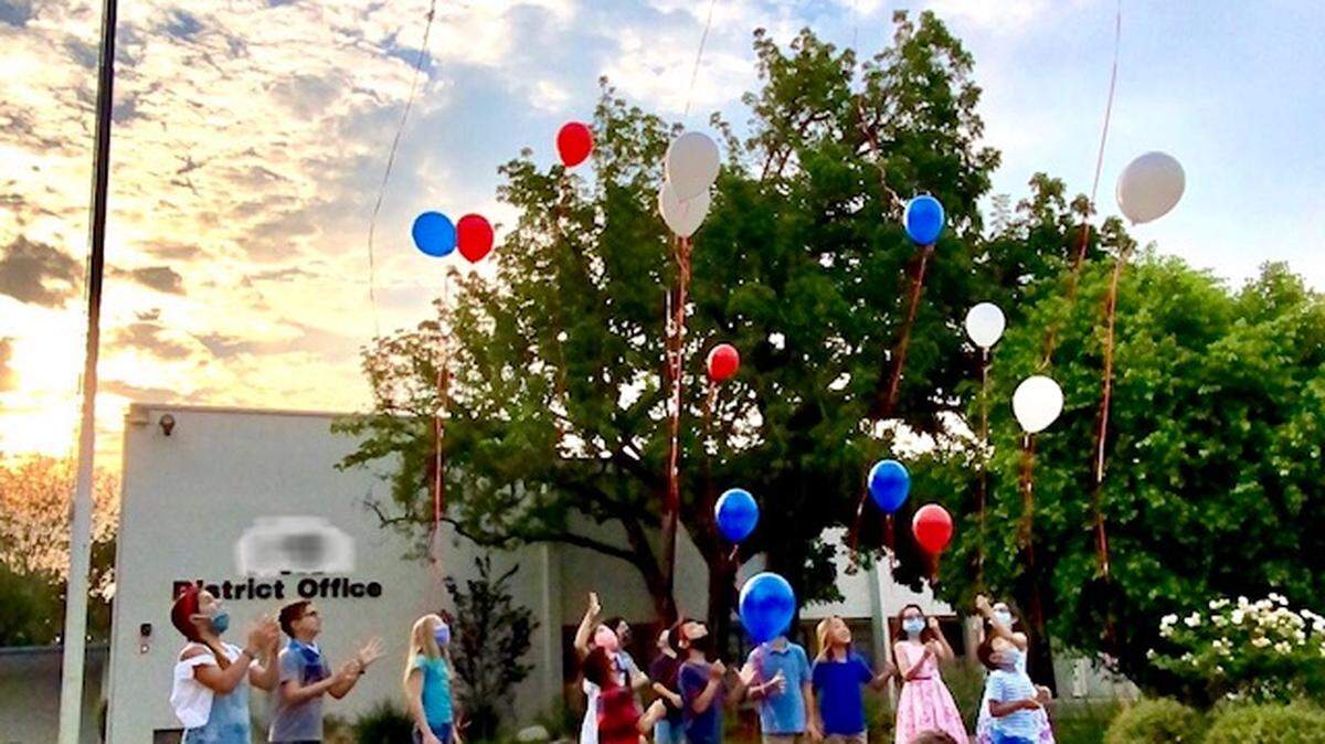 Jill Simonian organized a Pledge of Allegiance event on her school district’s lawn. The event drew controversy in local parent groups for being conducted in-person.