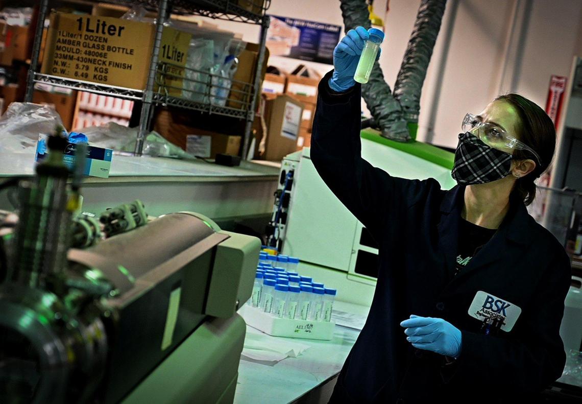 BSK Associates chemist Michelle Scire, specializing in levels of metals in ground water, checks a sample, Dec. 29, 2021. The water testing facility has had 13 PG&E power outages over 30 days, costing $50 thousand each outage, along with overtime due to retesting, and loss of equipment, according to BSK Associates’ Senior Laboratory Solutions Administrator, Mike Brechman.