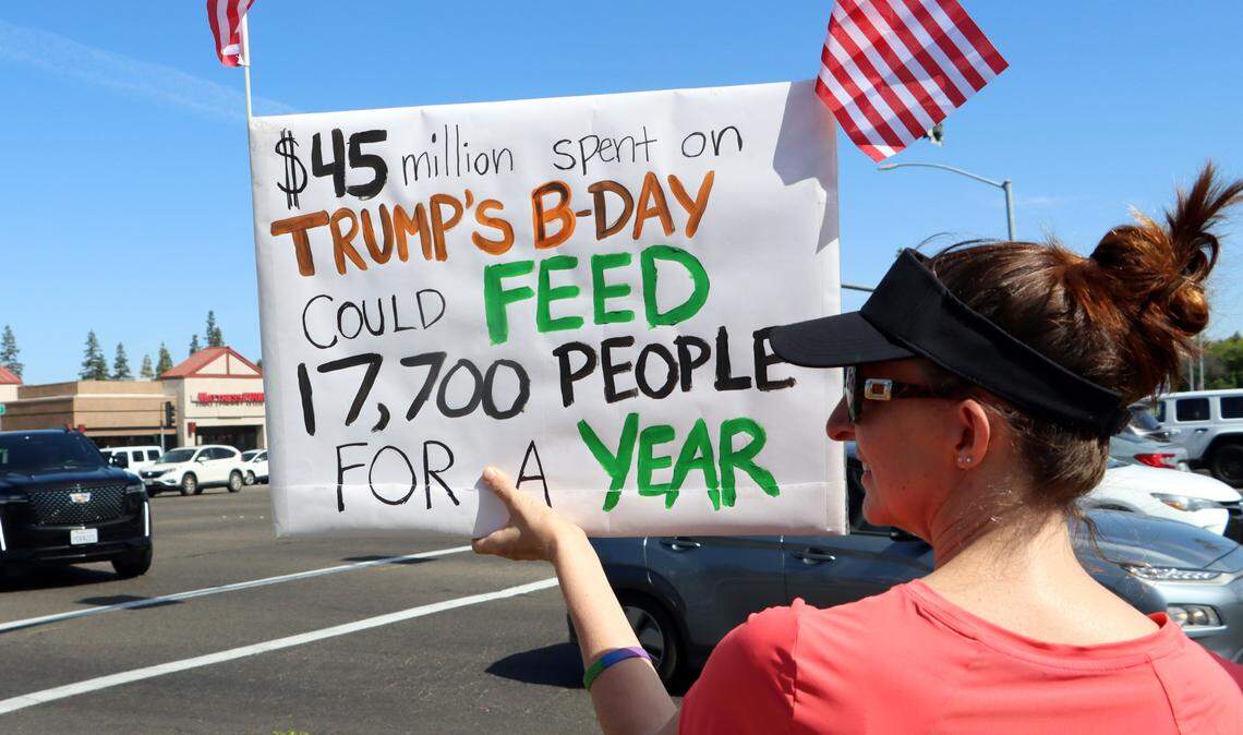 A protester carries a sign during the No Kings Rally held June 14, 2025 at Riverpark Shopping Center.