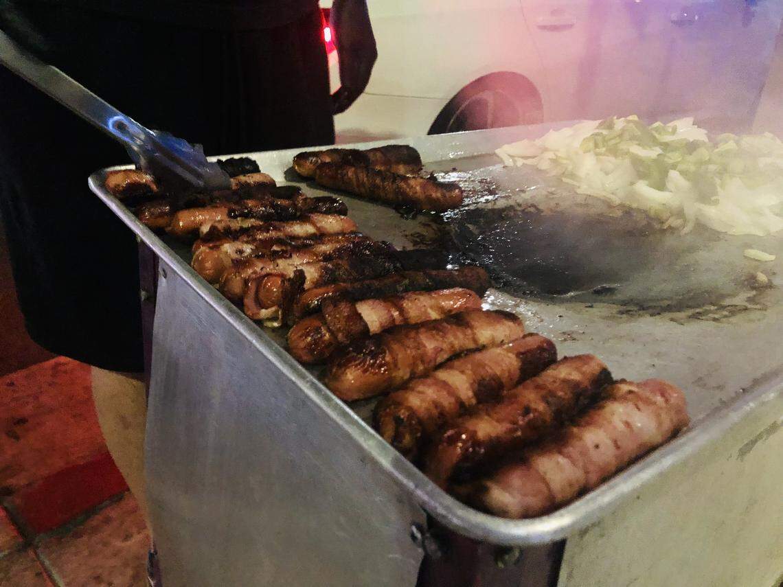 Kingglizzy559, a food stand that specializes in bacon-wrapped hot dogs, often is set up at various corners in the Tower District. The owner, whose goes by the name of Lerch, prefers to set up his operation just outside of bars and clubs to attract customers after they’ve been drinking and/or dancing.