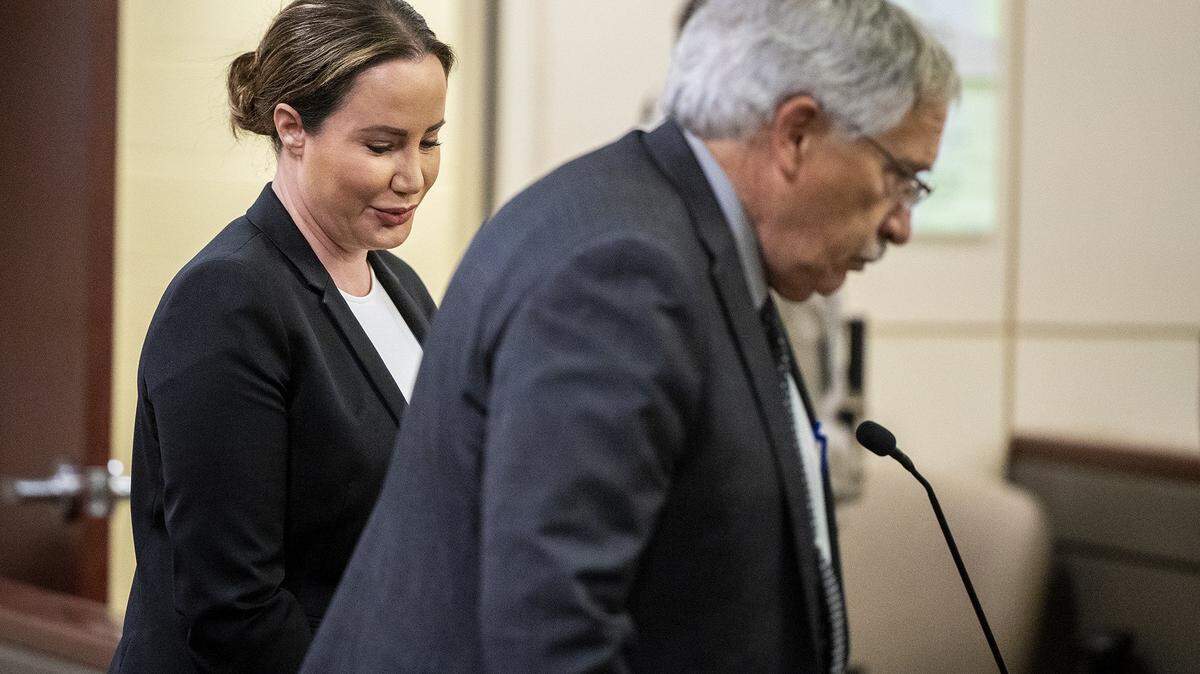 Lori Rossi Gallo, left, turns to leave the courtroom after appearing before Merced County Superior Court Judge Carol Ash, with attorney Peter Jones, right, during a pre-preliminary hearing in Merced, Calif., on Thursday, June 23, 2022.