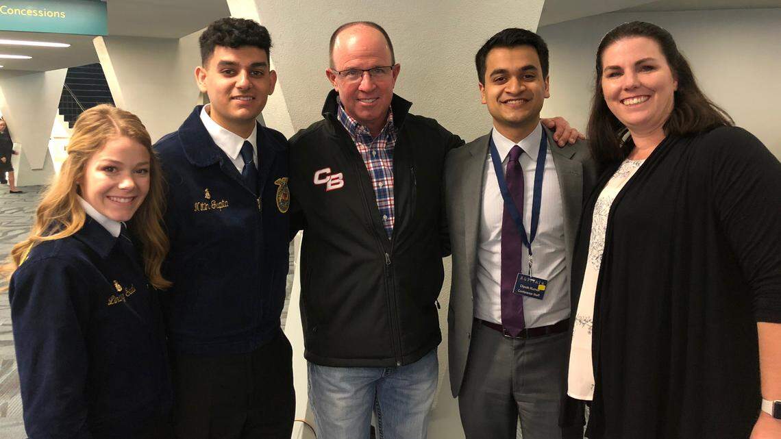 Tulare Joint Union High School District agriculture teacher Kevin Koelewyn, center, died recently while attending the National FFA Convention in Indianapolis. This photo was taken at the state FFA convention in April.
