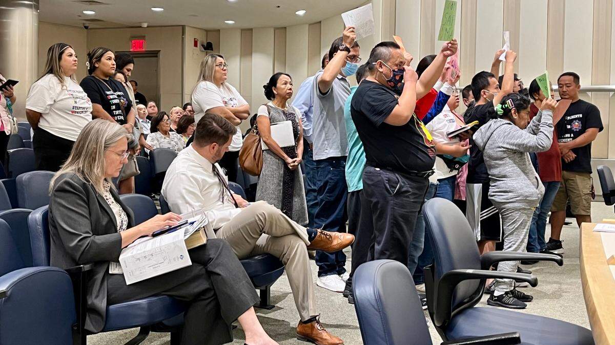 Fresno Planning Director Jennifer Clark, seated far left, and planning manager Phillip Siegrist, listen as clients and staff at the Rivendell Adult Development Center for special-needs people protest to the Fresno City Council on Thursday, Aug. 24, 2023, against a proposed automated drive-through car wash adjacent to the center at McKinley and Fine avenues, near the Fresno Yosemite International Airport.