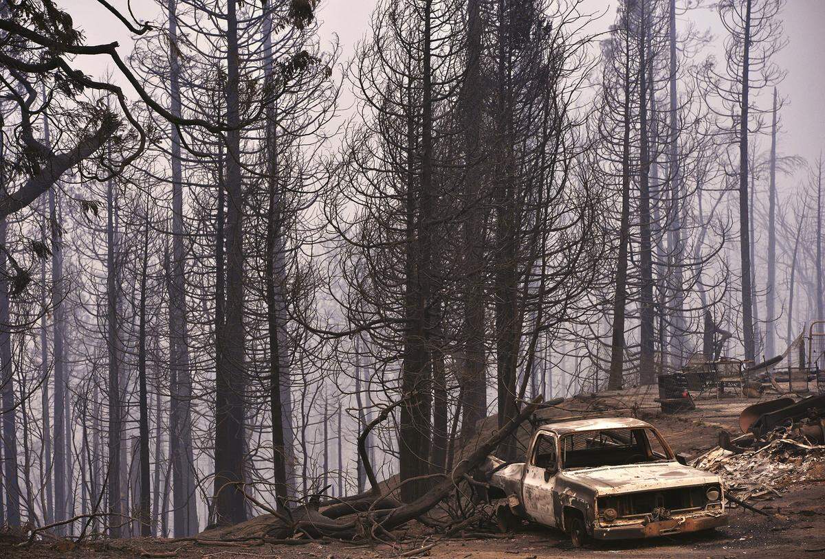 A pickup truck charred by the Creek Fire is seen across the street from Pine Ridge Elementary School near Highway 168 Friday, Sept. 11, 2020 at Pineridge.