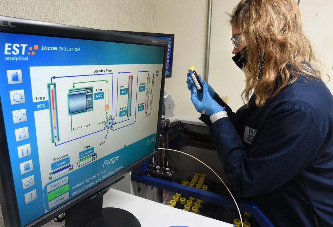 Amy Novak, BSK Associates ground and waste water analyst, conducts a test Dec. 29, 2021. The water testing facility has had 13 PG&E power outages over 30 days, costing $50 thousand each outage, along with overtime due to retesting, and loss of equipment.