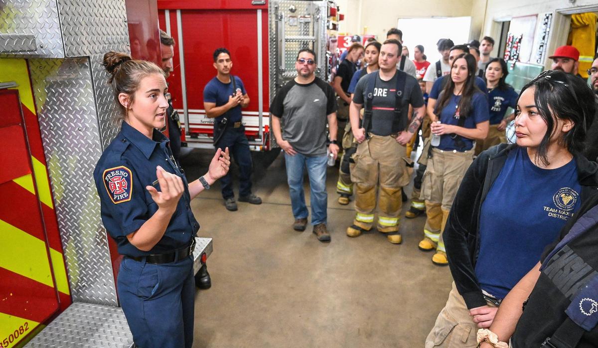 Fresno firefighter Alexis Rumbolz leads a tour through the Fresno Fire Department’s historic Fire Station 3 during the department’s annual “Firefighter for a Day” event where citizens can get an inside look at the job of a firefighter, at the department’s training grounds in Fresno on Saturday, Oct. 22, 2022.