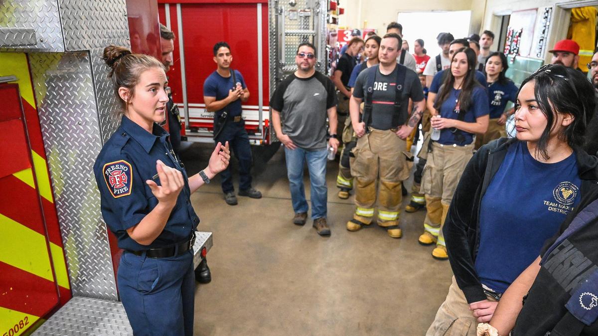 Fresno firefighter Alexis Rumbolz leads a tour through the Fresno Fire Department’s historic Fire Station 3 during the department’s annual “Firefighter for a Day” event where citizens can get an inside look at the job of a firefighter, at the department’s training grounds in Fresno on Saturday, Oct. 22, 2022.