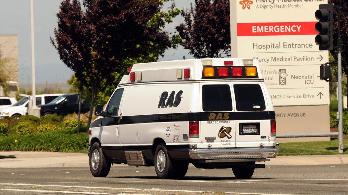 A Riggs Ambulance Service ambulance heads up G St towards Mercy Medical Center in Merced.
