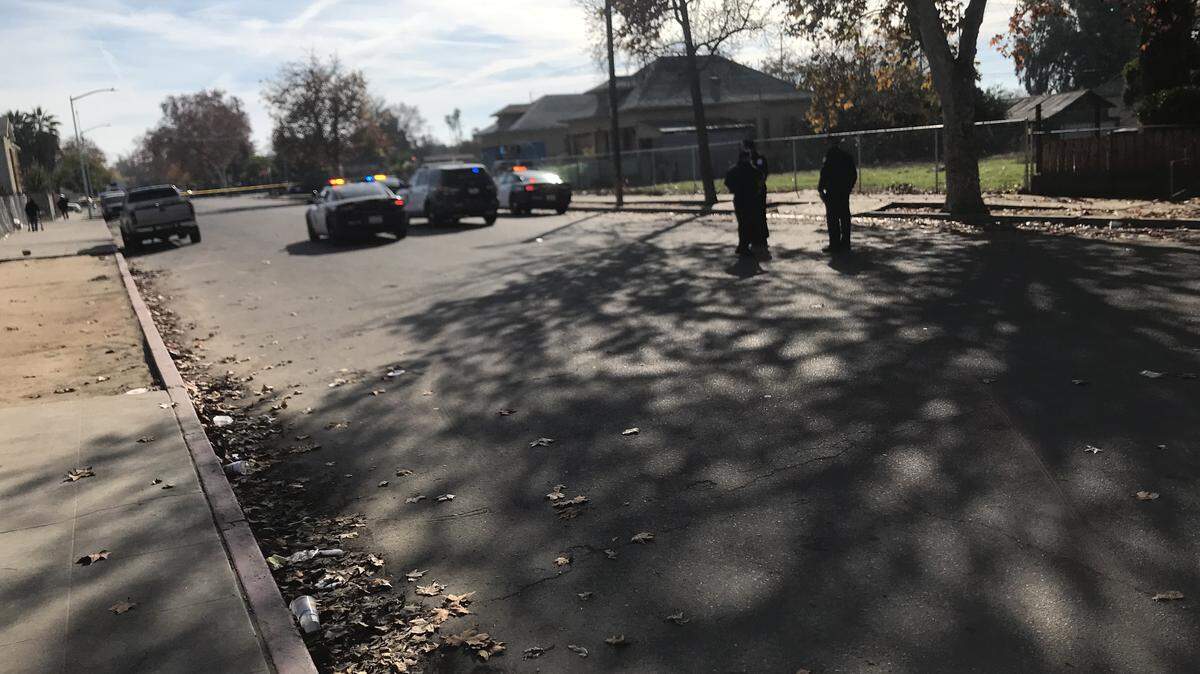 Police look for evidence after shots were fired in a domestic violence incident near the Poverello house at F and Santa Clara streets.
