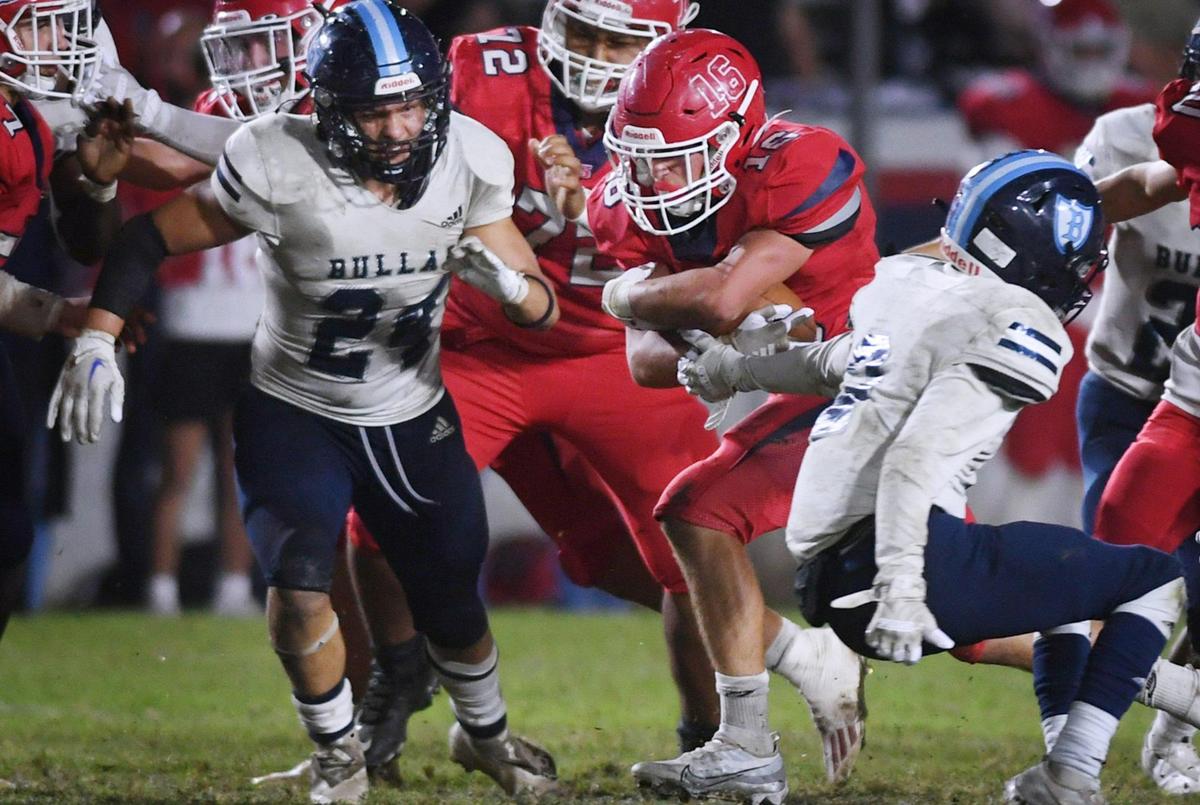 Sanger’s Marshall Pittman, center, finds a hole in Bullard’s defense as he runs for Sanger’s last touchdown of the 42-6 game Friday, Oct. 21, 2022 in Sanger.