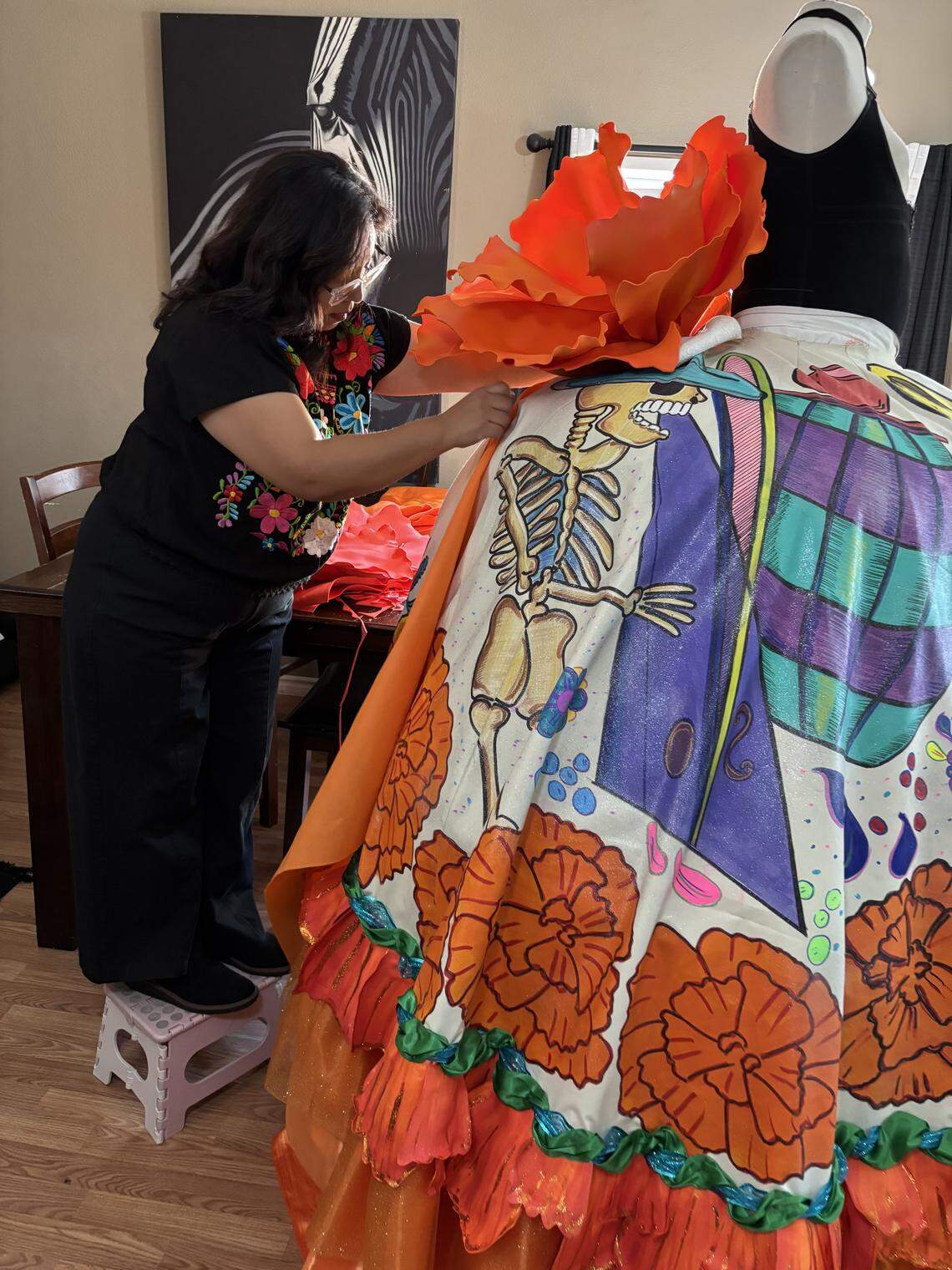 Leticia Valencia has brought La Catrina of Visalia to life for over a decade. She and her husband, Claudio Martínez, create the dresses La Catrina wears each year.