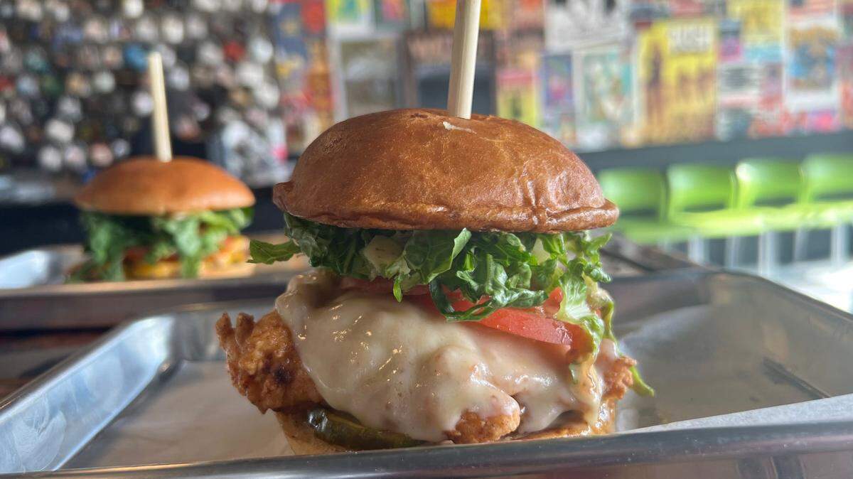 Fried chicken sandwiches like this one are on the menu at Cheeks’ Chicken & Burgers. The restaurant serves lunch and dinner after Benaddiction restaurant finishes its breakfast service.