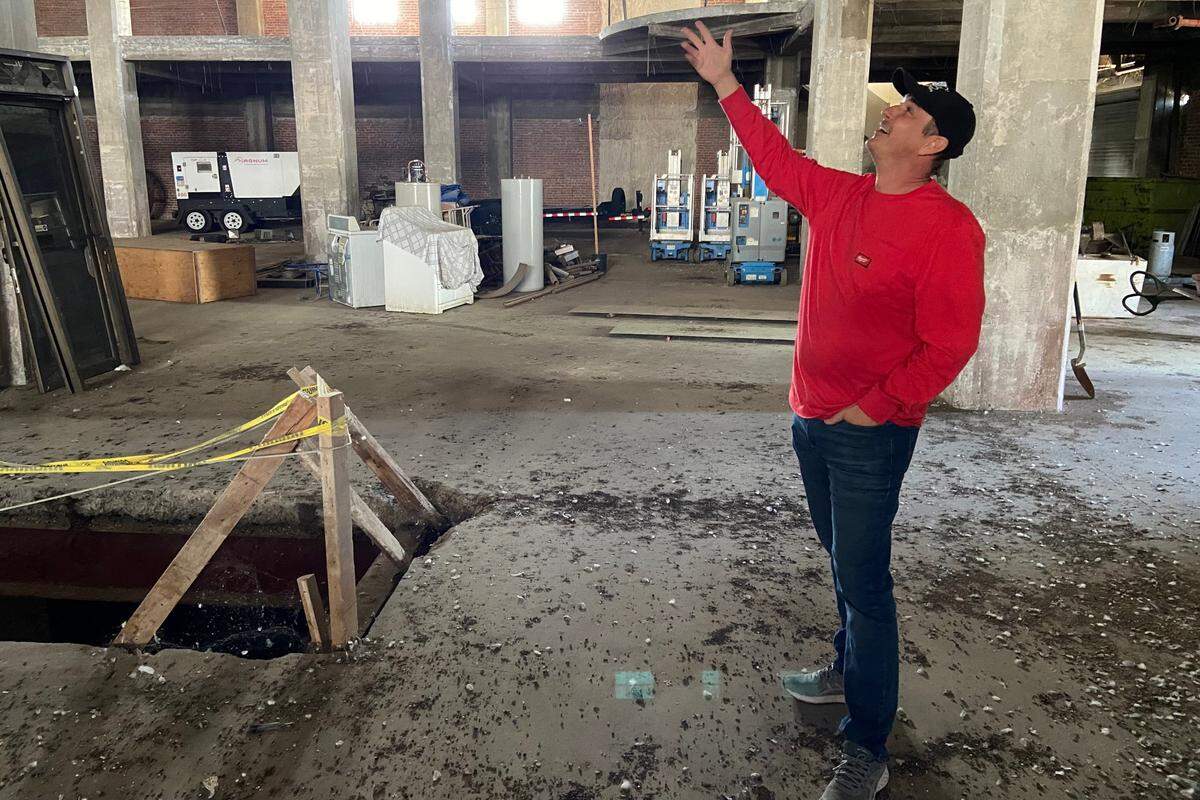 Will Dyck, president and CEO of Summa Development Group, gestures toward an empty space in the JC Penney building where a central elevator used to be. Dyck has submitted plans to transform Fresno’s oldest department store, vacant since the 1980s, into a 160-unit apartment building.