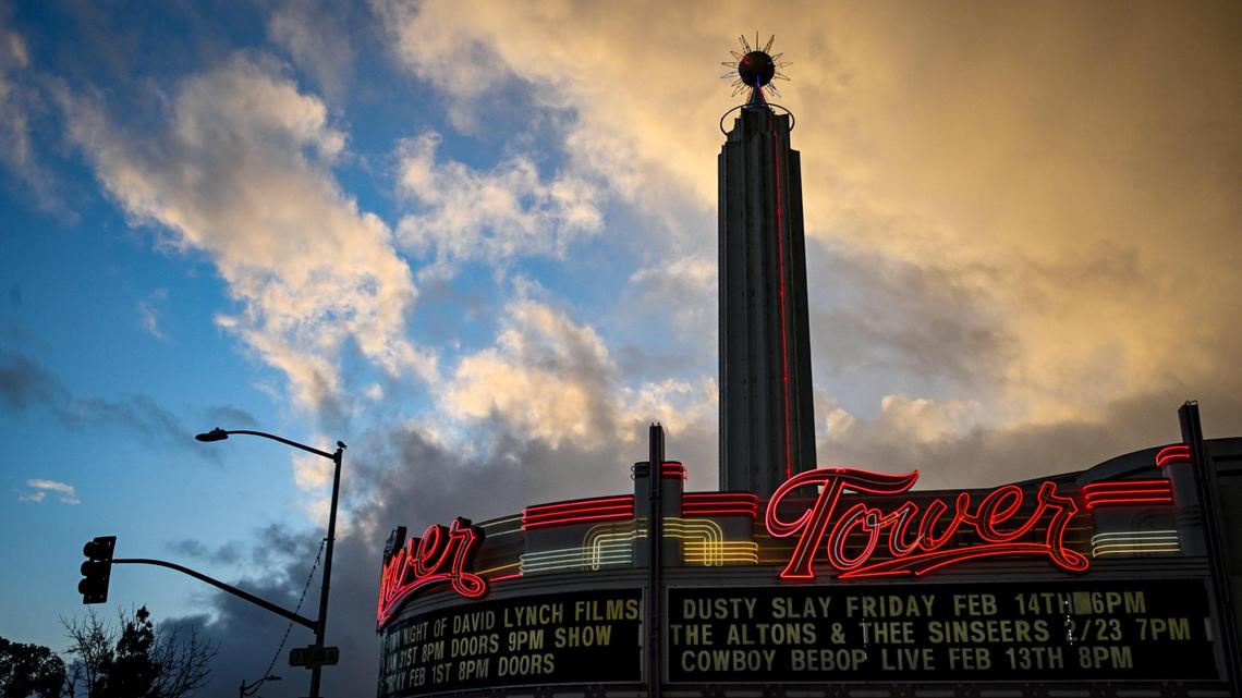 Clouds loom over the Tower Theatre in Fresno’s Tower District following heavy rain on Thursday, Feb. 13, 2025. Bands of clouds brought in strong thunderstorms through the area with showers possible through Friday.