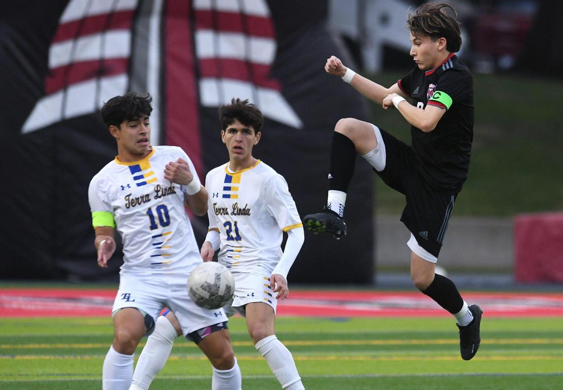McLane’s Cristian Garcia, right, attacks with Terra Linda’s Chris Maldonado, to the far left, and Francesco Calvi, center, in the CIF Northern California Regional Division III boys soccer championship Saturday, March 4, 2023 in Fresno. Terra Linda won the championship, 2-0.