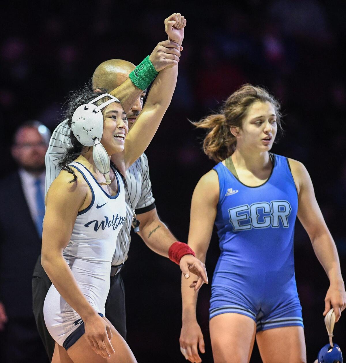 Clovis East’s Isabell Gonzales, left, is declared the winner in the girls 116-pound CIF State Wrestling Championship match after defeating Alex Waitsman of El Camino at Mechanics Bank Arena in Bakersfield on Saturday, Feb. 25, 2023.
