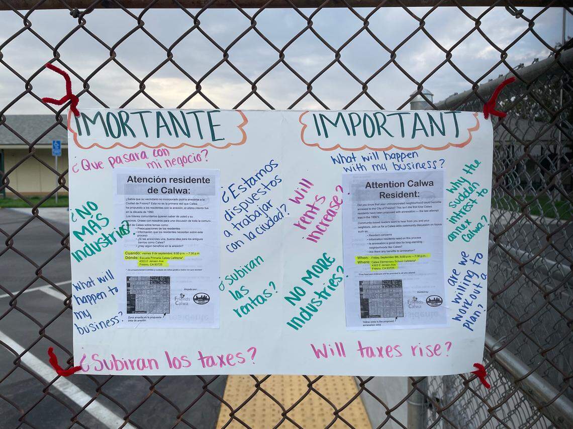 A poster outside of Calwa Elementary School features questions on the potential annexation of a portion of the county island of Calwa by the city of Fresno. The community meeting was hosted by nonprofit organizations Friends of Calwa and Fresno Building Healthy Communities on Friday, Sept. 8, 2022.