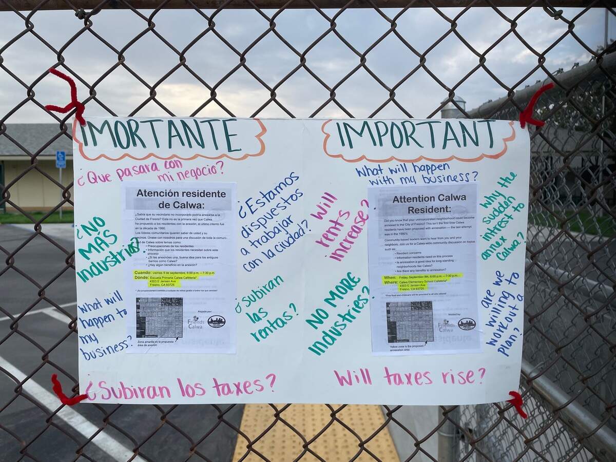 A poster outside of Calwa Elementary School features questions on the potential annexation of a portion of the county island of Calwa by the city of Fresno. The community meeting was hosted by nonprofit organizations Friends of Calwa and Fresno Building Healthy Communities on Friday, Sept. 8, 2022.