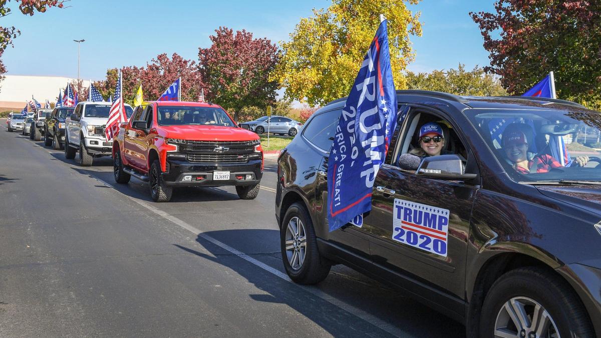 Donald Trump supporters line up in their vehicles as they depart the parking lot at Sierra Vista Mall in Clovis for a Trump parade through town and journey up Highway 168 to Shaver Lake on Sunday, Nov. 15, 2020. Organizers billed it as, “One more parade to support our president and the local businesses in Shaver because of the Creek Fire!” About 50 vehicles participated in the event.