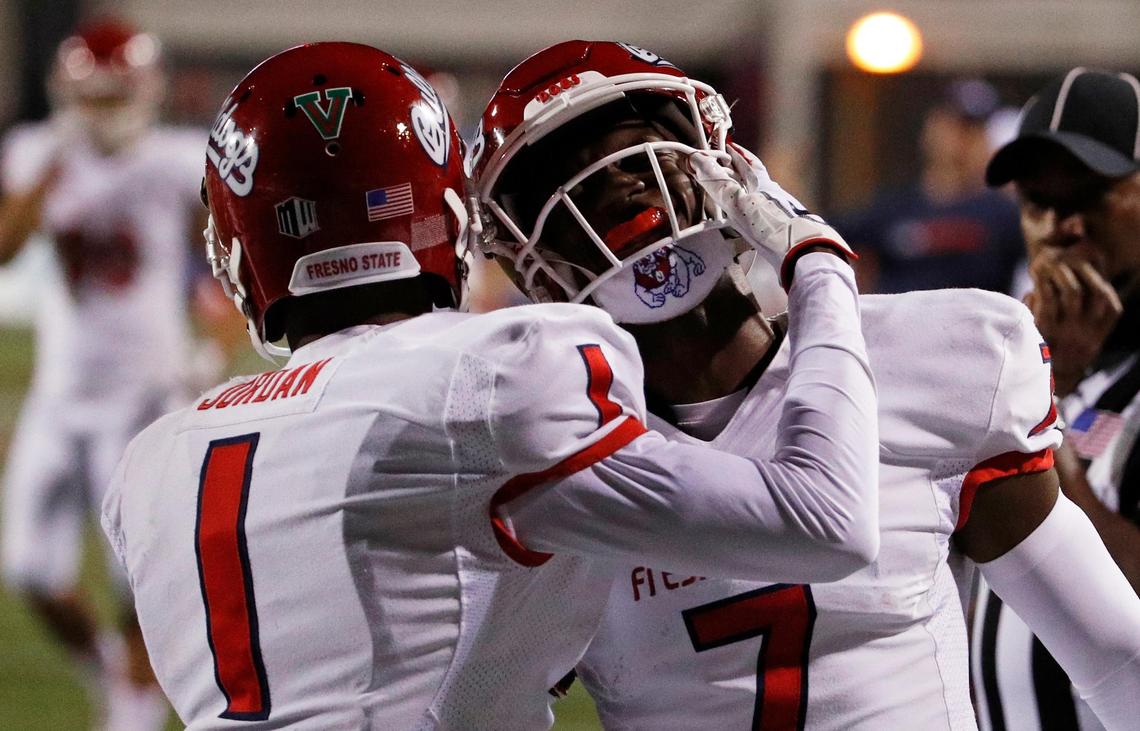 Fresno State Bulldogs wide receiver Jamire Jordan (1) celebrates after wide receiver Derrion Grim (7) scored a touchdown in the Bulldogs’ 48-3 victory over the UNLV Rebels at Sam Boyd Stadium in Las Vegas Saturday, Nov. 3, 2018. The victory was the Bulldogs’ seventh in a row..