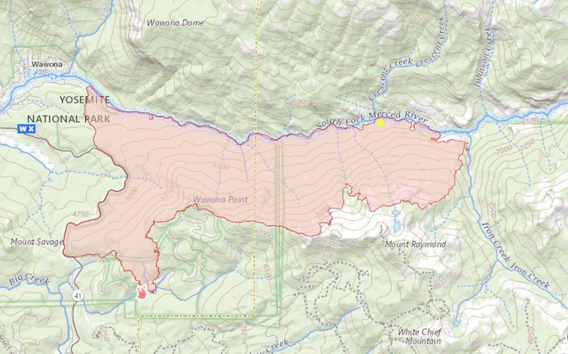 A map shows the perimeter of the Washburn Fire in Yosemite National Park and the Sierra National Forest as of Tuesday morning, July 19, 2022. The western half of the fire, which started July 7, is considered contained, and crews are working to shore up lines in the Iron Creek drainage, at right.