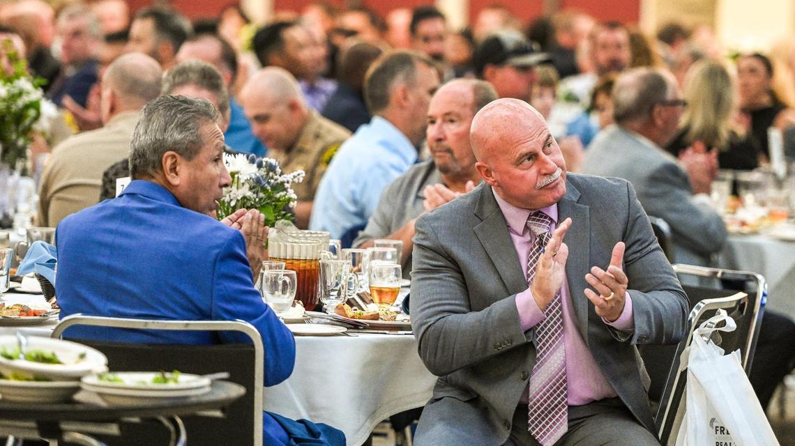 Fresno Mayor Jerry Dyer, right, and former Fresno County supervisor Henry R. Perea applaud during the annual State of the County luncheon at the Fresno Convention Center’s Valdez Hall on Tuesday, September 27, 2022.