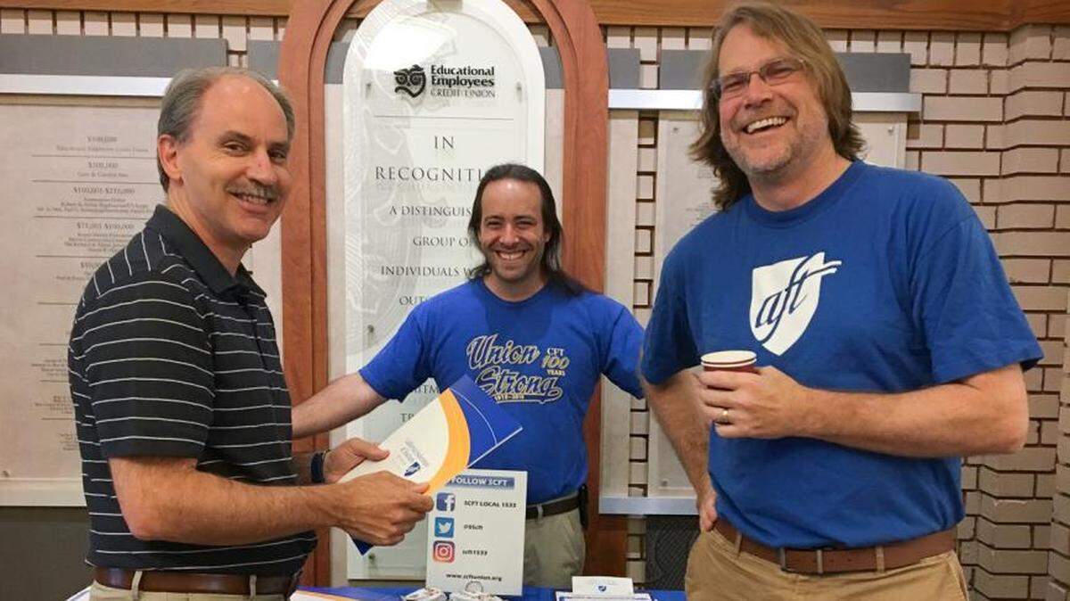 Keith Ford, right, shown with colleagues Mark Trezza, left, and Paul Gilmore, center, during a 2019 union membership drive at Fresno City College.