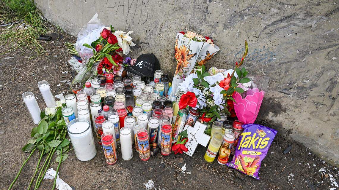 A memorial with candles and flowers has been left at the site of a crash that killed four people early Sunday near the freeway onramp at Highway 99 and Avenue 17 in Madera County. Photographed on Tuesday, Feb. 17, 2026.