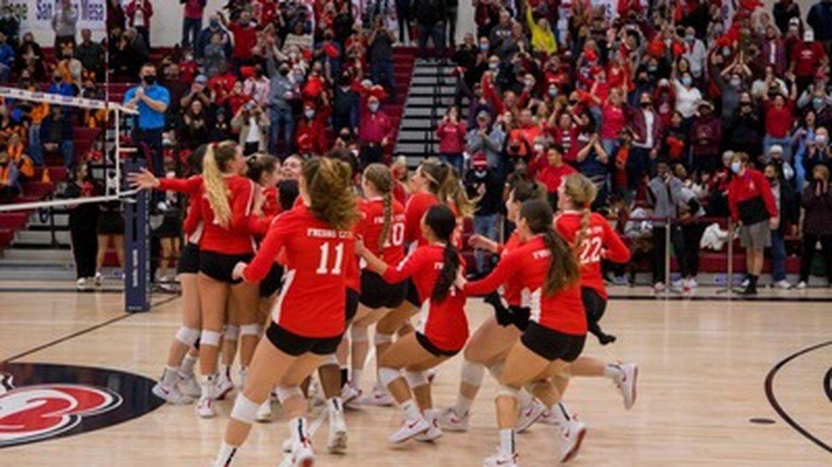 The Fresno City College volleyball team sprint to the court after clinching the school’s second state title on Sunday, Dec. 5, 2021.
