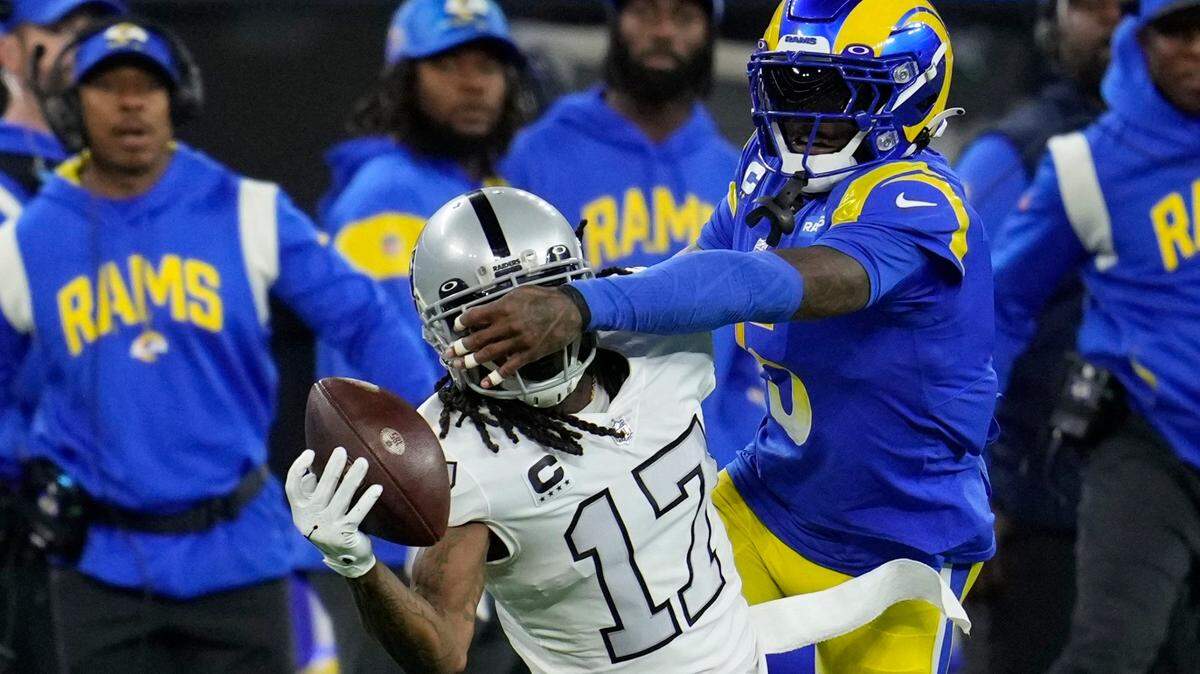 Las Vegas Raiders wide receiver Davante Adams makes a one-handed catch as Los Angeles Rams cornerback Jalen Ramsey defends during the first half of an NFL game Thursday, Dec. 8, 2022, in Inglewood, Calif.