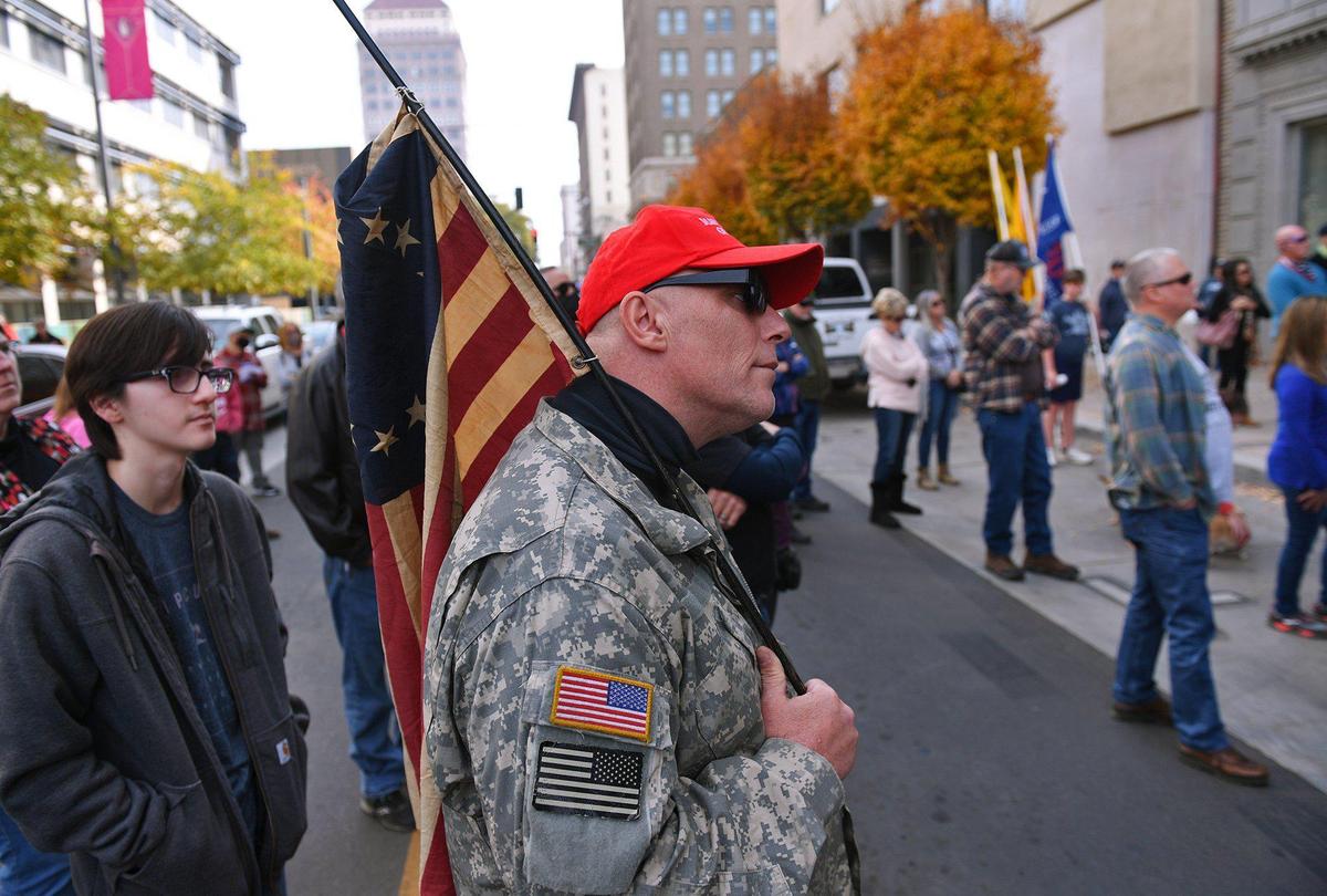 At least 200 people gathered on Fulton Street in front of the Fresno County Department of Public Health to protest California and Governor Gavin Newsom’s purple-tier coronavirus restrictions on businesses during a rally Saturday, Nov. 21, 2020, in downtown Fresno.