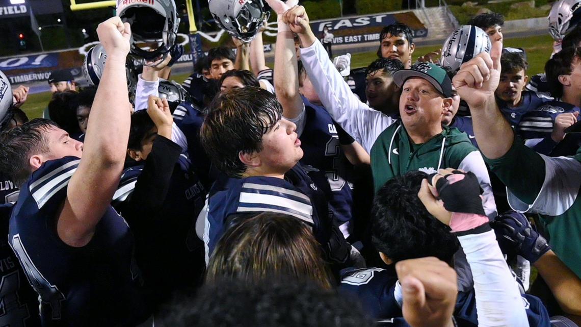 Clovis East head coach Brandon Nagle, right, celebrates the team’s 38-21 TRAC Championship win over Clovis North Friday, Nov. 1, 2024 in Clovis. Friday, Nov. 1, 2024.