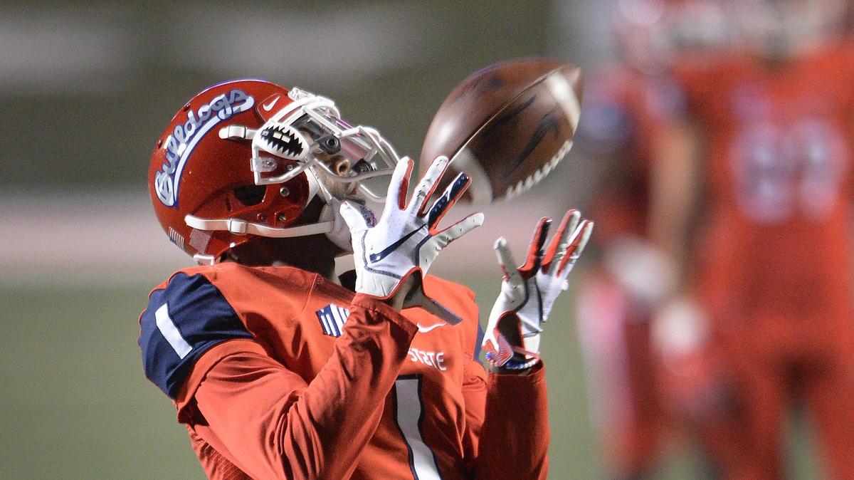 Fresno State wideout Jamire Jordan catches a ball during warm-ups before the start of their game against San Diego State at Bulldog Stadium in Fresno on Saturday, Nov. 17, 2018.