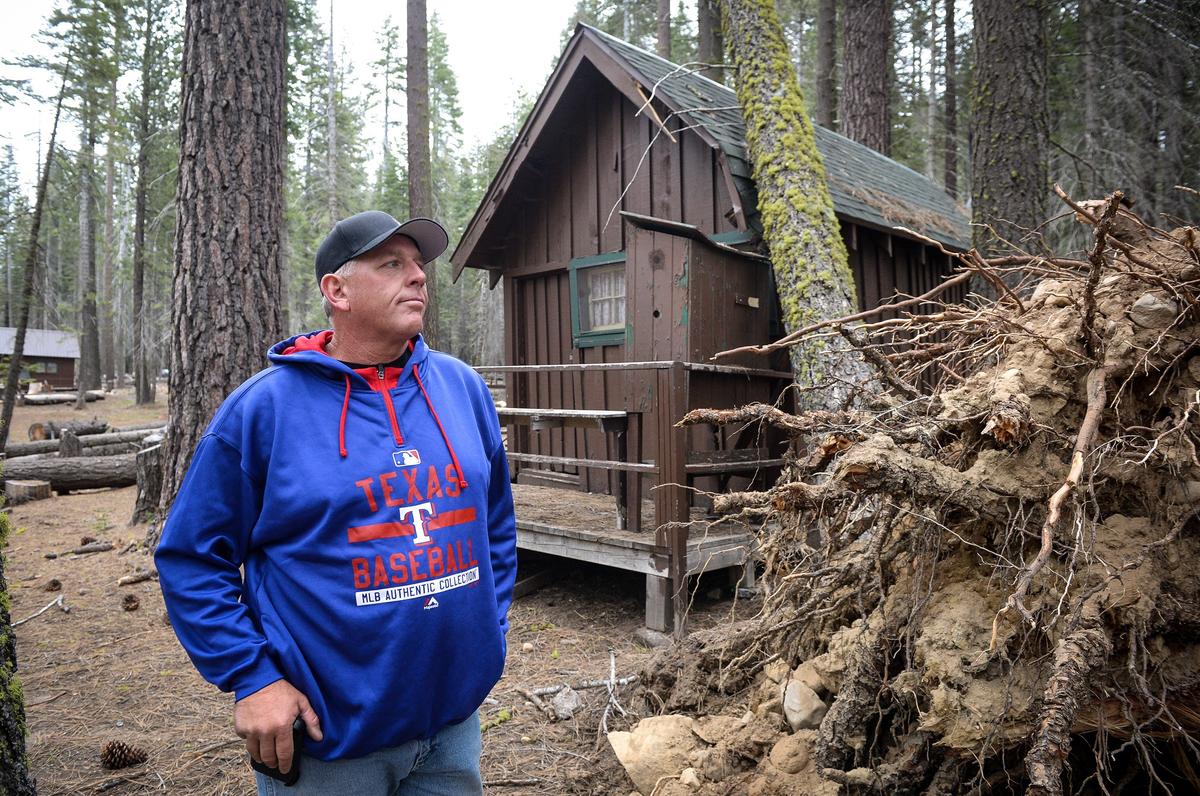 Former Camp Fresno concessionaire Jarrod Deaver stands near a dead tree that had fallen into a cabin, at the campground on Monday, May 6, 2019. Deaver and his wife Jennifer removed many marked trees on their own in 2017 to get the camp operational. Instead of receiving money back from the city of Fresno for their work, they got a bill.