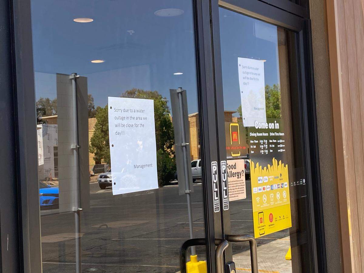 McDonald’s, located at Olive and Crystal avenues in Fresno, California, post a sign of telling customers its restaurant is closed because of a water main line break.
