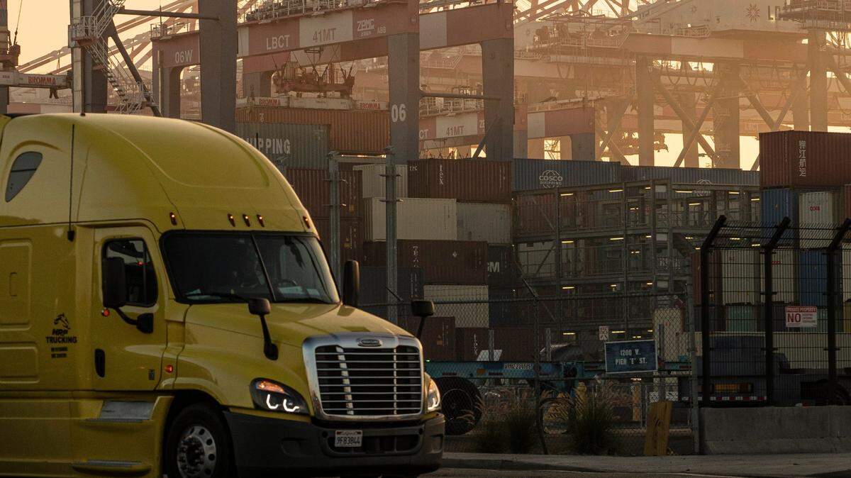 A truck drives out of the Long Beach Container Terminal in Long Beach on Nov. 30. U.S. Secretary of Labor Marty Walsh visited the Port of Los Angeles to see the shipping backlog firsthand.