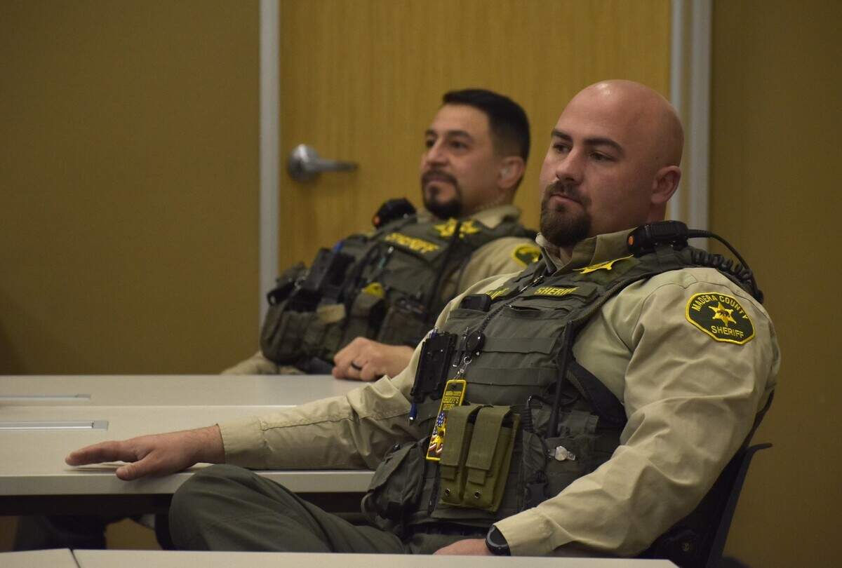 Madera County Sheriff’s Office deputies listen to a morning briefing Friday Dec. 20, 2024.