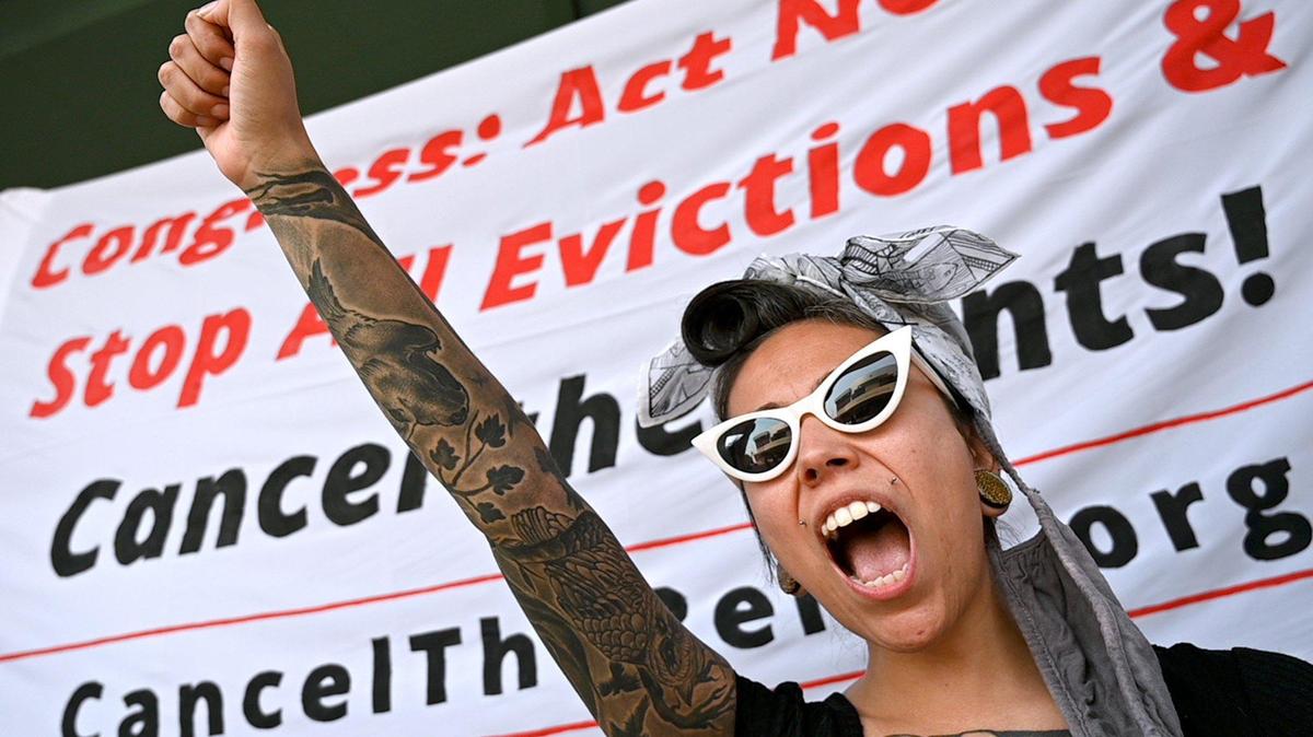 Lethal Garcia of Fresno joins in a chant during the Stop All Evictions! protest Saturday Sept. 25, 2021, in front of Rep. Jim Costa’s office.