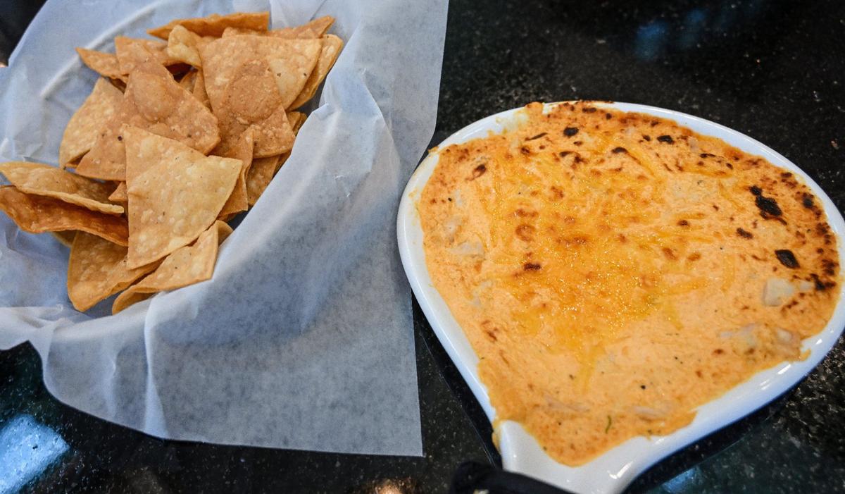 Sam’s buffalo chicken dip and chips is served up at Mad Duck at its newest location at Maple and Copper avenues in north Fresno.