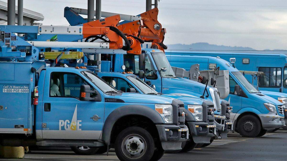 Pacific Gas & Electric vehicles are seen parked at the PG & E Oakland Service Center Monday, Jan. 14, 2019, in Oakland, Calif. Facing potentially colossal liabilities over deadly California wildfires, PG&E will file for bankruptcy protection. The announcement today follows the resignation of the power company’s chief executive. (AP Photo/Ben Margot)