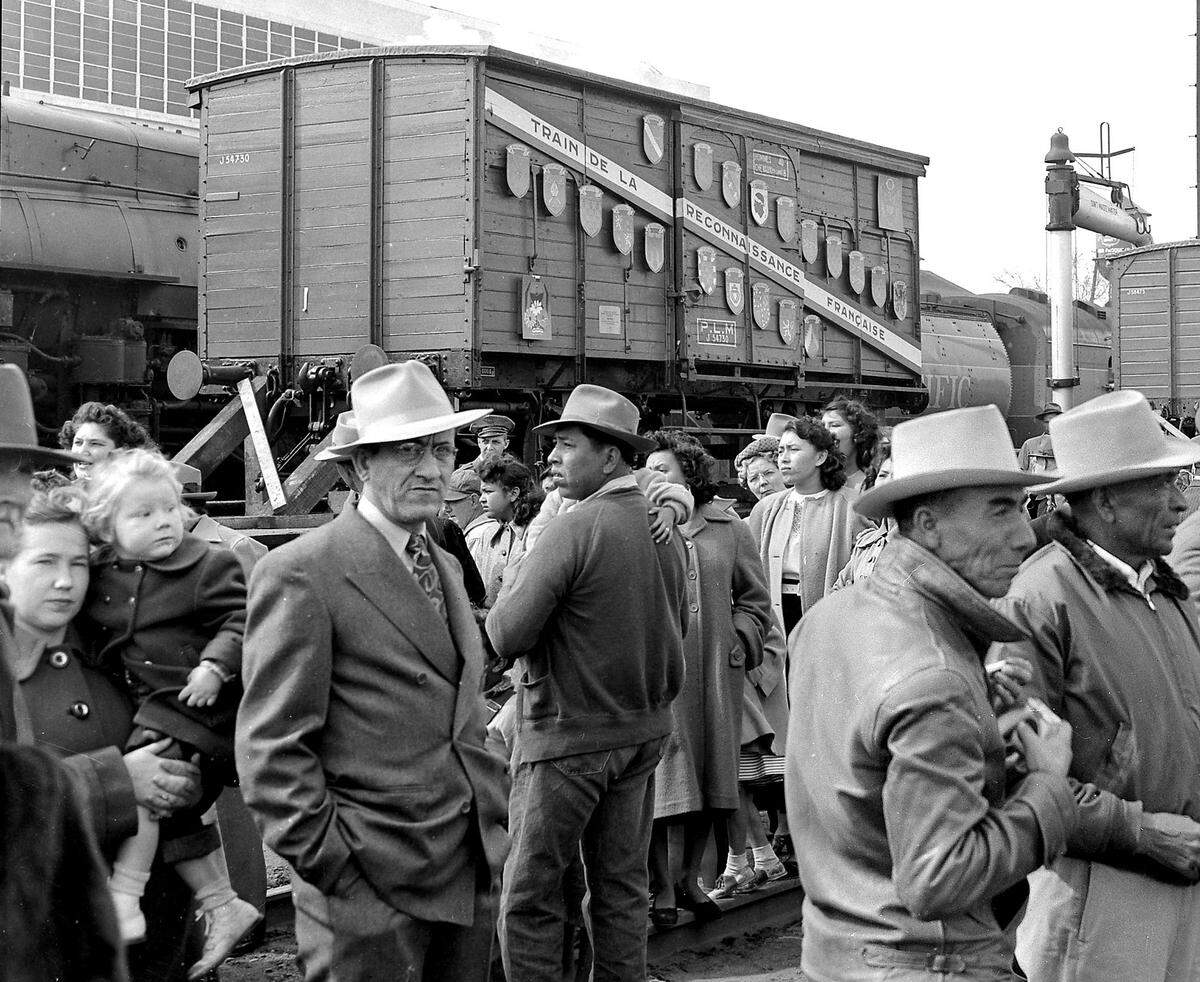 Crowds assemble on the morning of Feb. 20, 1949, for the arrival of the French Merci boxcar to Fresno at the Southern Pacific depot.