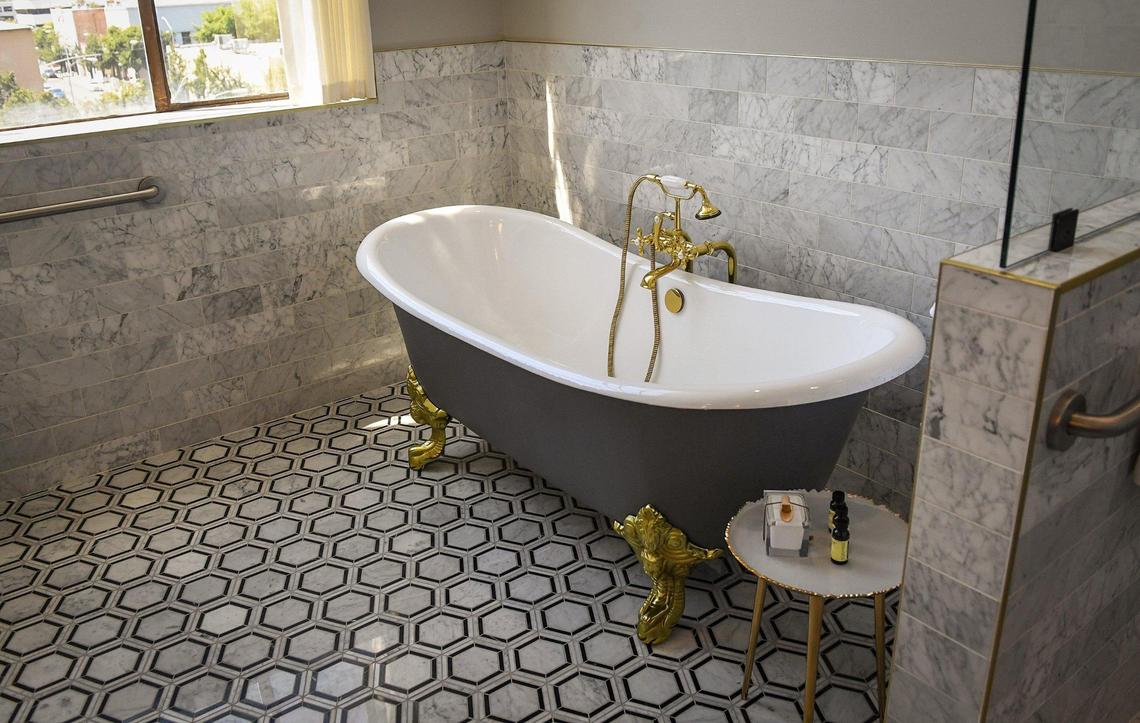 An old-fashioned claw-foot bathtub featured in a room at the Darling Hotel reflects the old-timey 1930s style captured in accents all over the hotel.