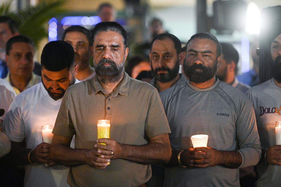 Mourners gather in Merced’s Bob Hart Square on Thursday to remember four family members who were kidnapped at gunpoint and murdered.