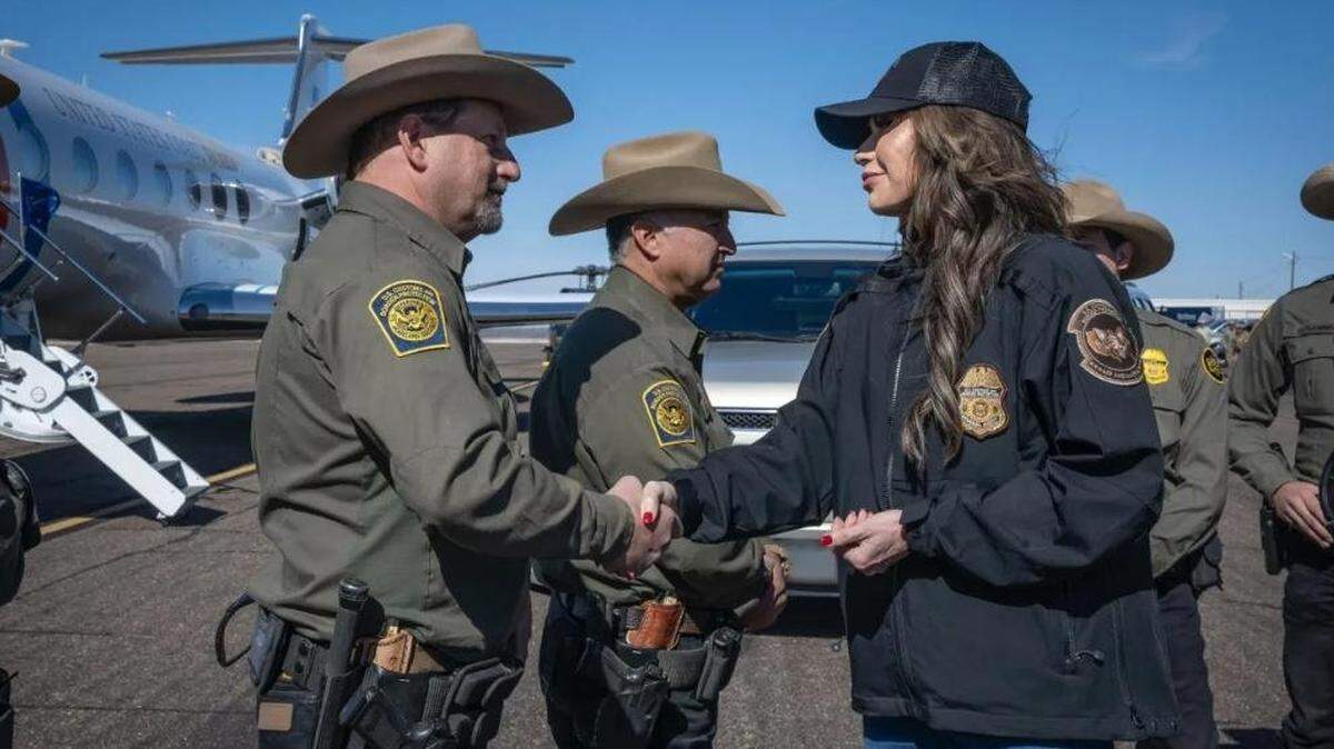 Department of Homeland Security Secretary Kristi Noem meets with Customs and Border Protection agents at the border with Mexico. The agency reported on Wednesday that more than 20,000 undocumented immigrants were arrested during the first month Donald Trump was president.